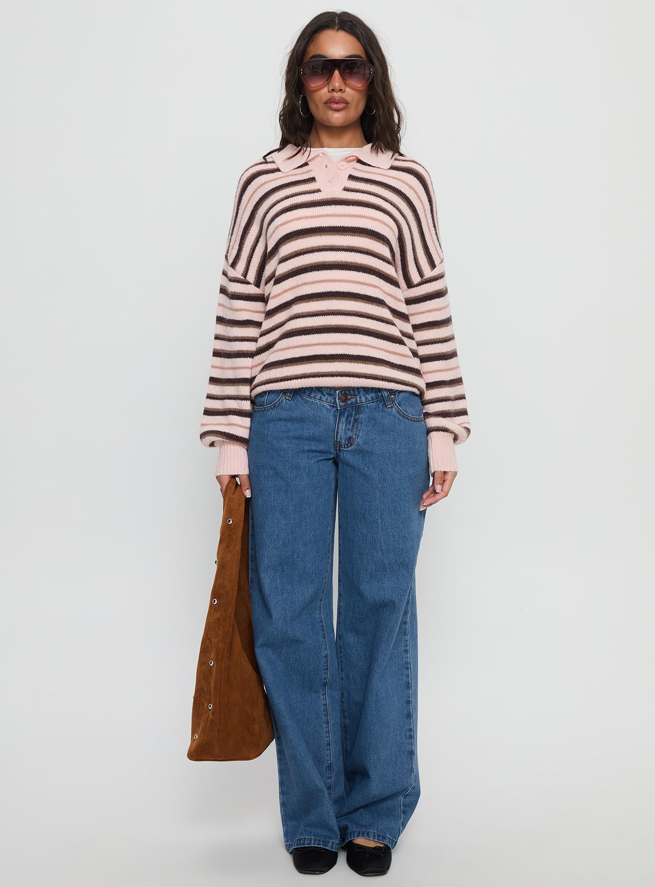 front view of model wearing Princess Polly Highlands Low Rise Wide Leg Jeans Mid Blue Wash Low Rise Jeans 