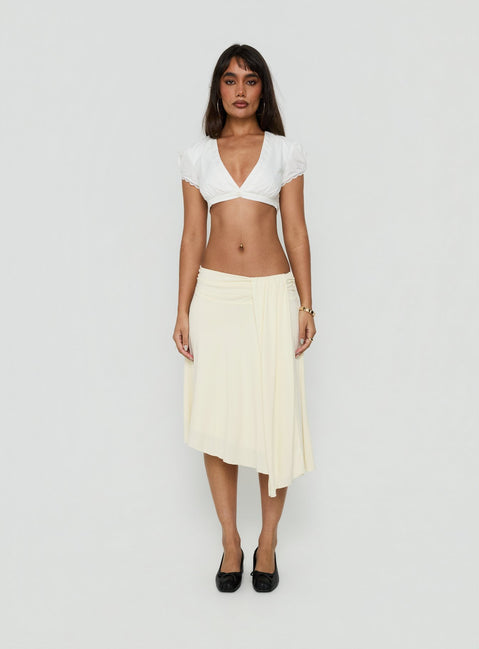 Crafted from cornsilk fabric, the Iselda Draped Midi Skirt Cream in womens-skirts features asymmetry Princess Polly