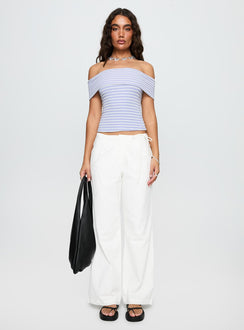 side view of model wearing Princess Polly Leyah Tie Side Pants White Low Rise Pants 