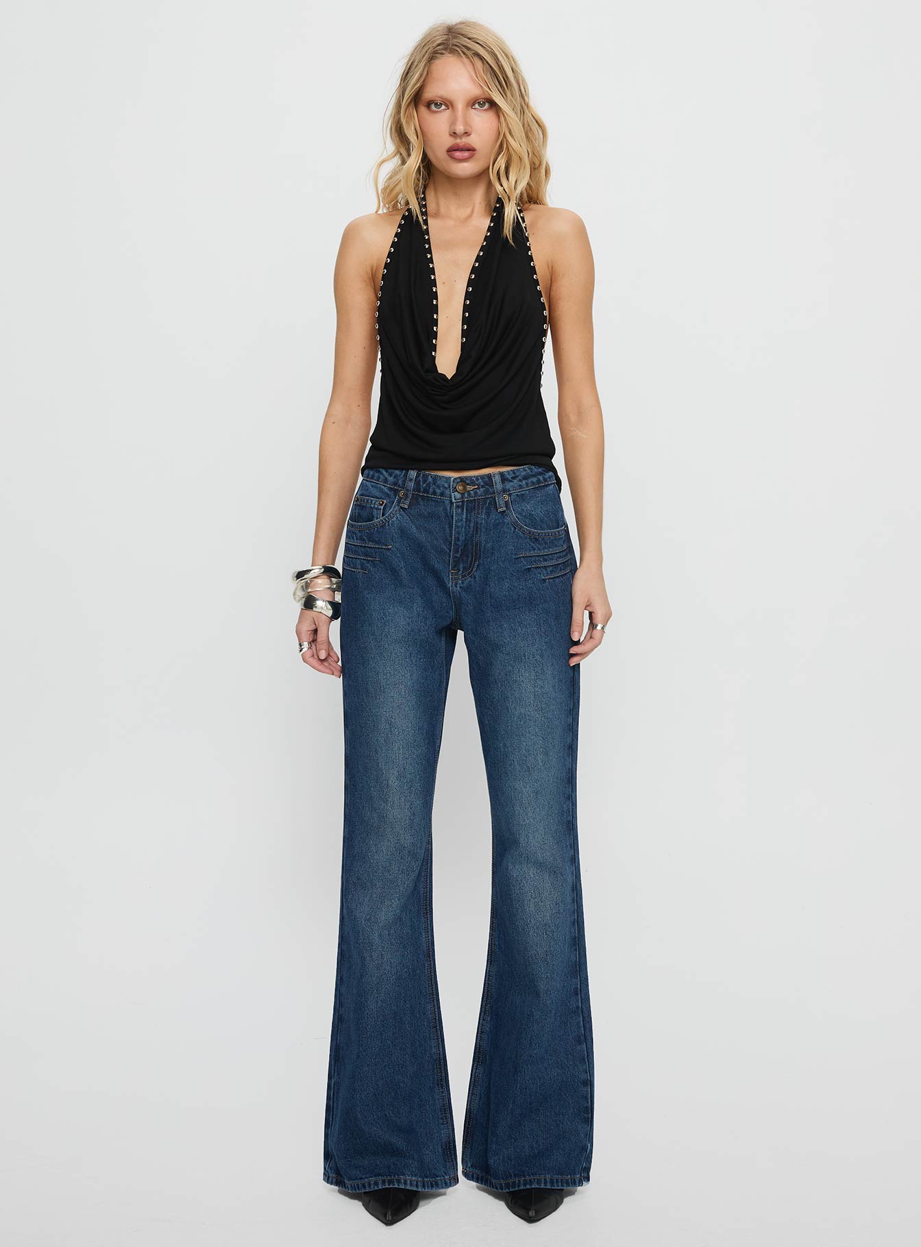 front view of model wearing Princess Polly Wide World Mid Rise Bootleg Jeans Mid Blue Mid Rise Jeans 