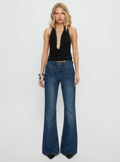 front view of model wearing Princess Polly Wide World Mid Rise Bootleg Jeans Mid Blue Mid Rise Jeans 