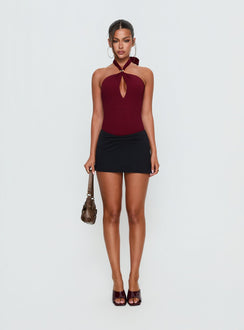 side view of model wearing Princess Polly Bridey Cut Out Bodysuit Red Sleeveless 