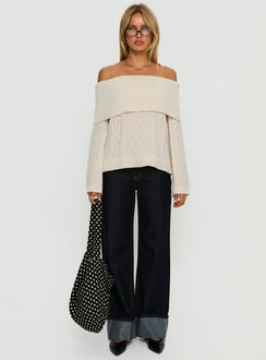 Featuring the Margarete Off Shoulder Knit Sweater Cream womens jumper with short length and oversized fit front view of model wearing Princess Polly