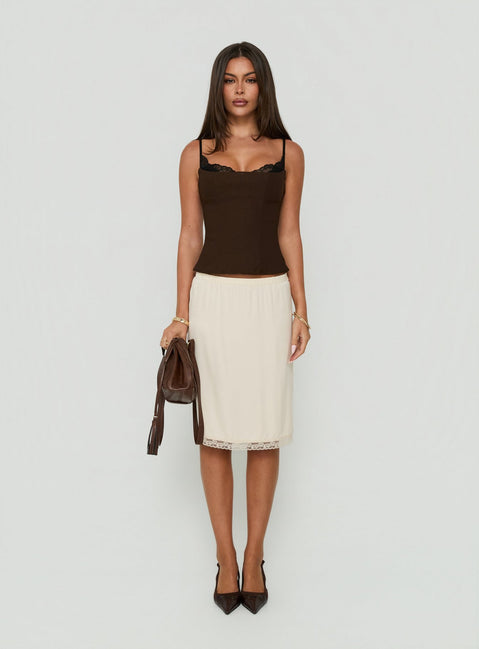 Shop the Bella Lace Trim Midi Skirt Butter in womens-skirts with midi length front view of model wearing