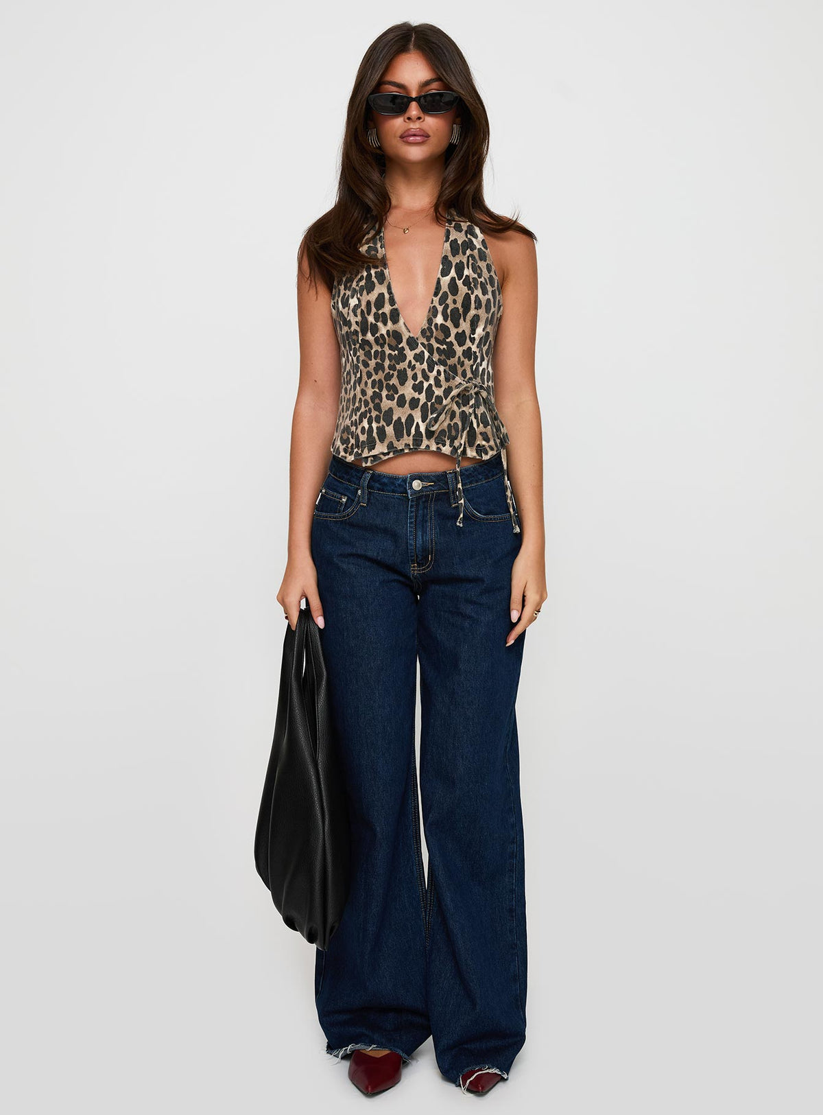 side view of model wearing Princess Polly Feel This Way Wrap Top Leopard Sleeveless Plunger 