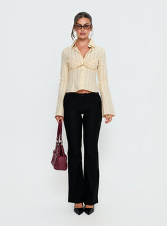 front view of model wearing Princess Polly Dariana Flare Pants Black Mid Rise Pants 