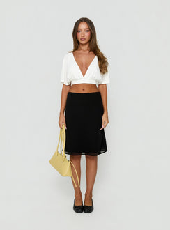 Discover the Anatola Midi Skirt Black womens-skirts with midi length front view of model wearing Princess Polly