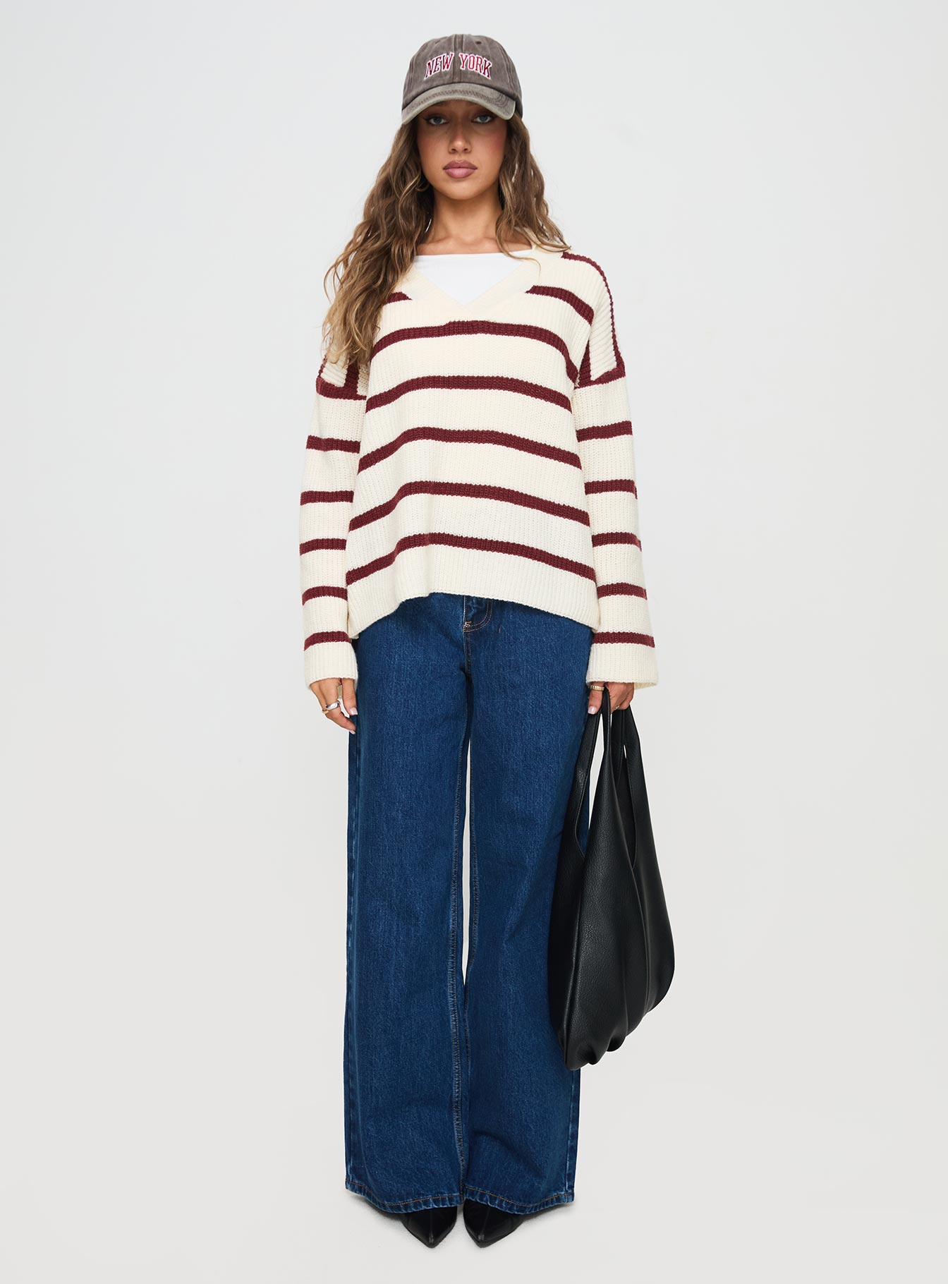 side view of model wearing Princess Polly Forte Knit Sweater Red / Cream Longline Jumpers Jumpers 