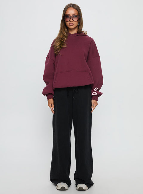 front view of model wearing Princess Polly Kisses Graphic Hoodie Wine Longline Jumpers Jumpers 