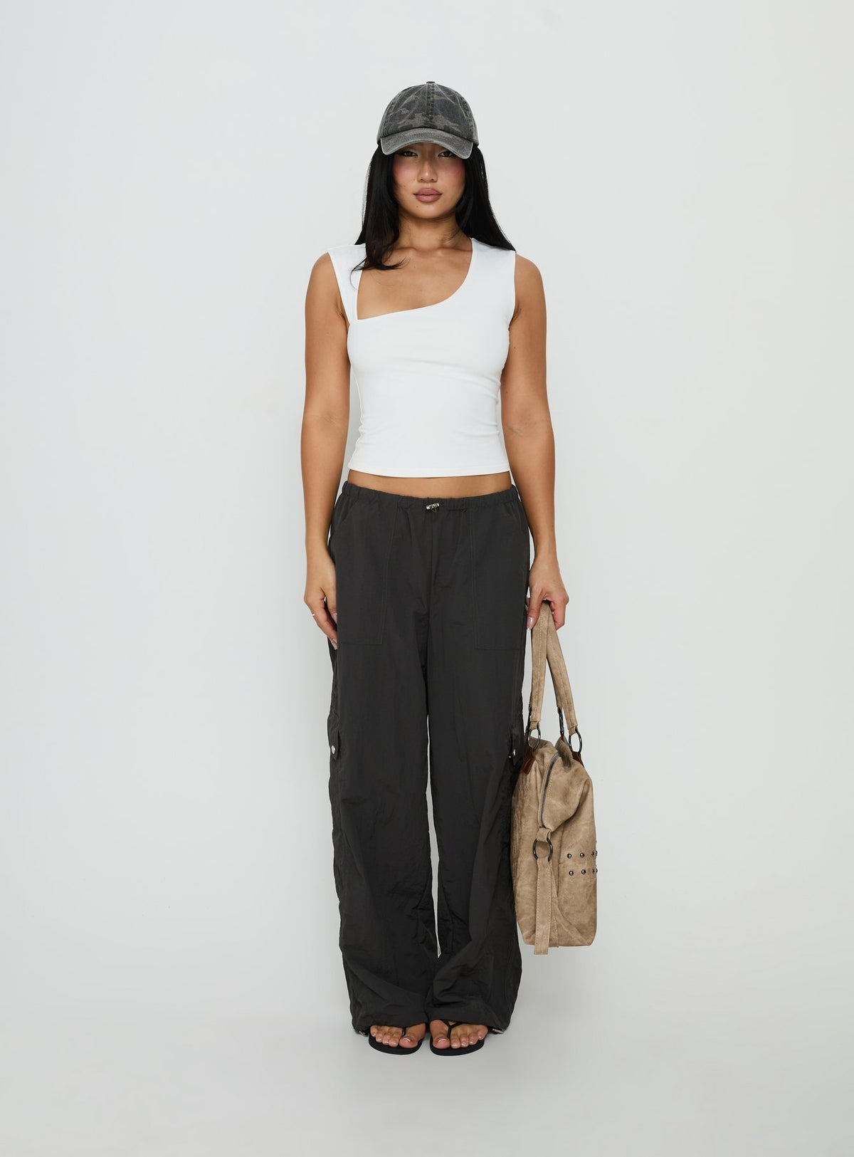 Showcasing the Lost On You Parachute Cargo Pants Charcoal in mid-rise womens-regular-pants front view of model wearing