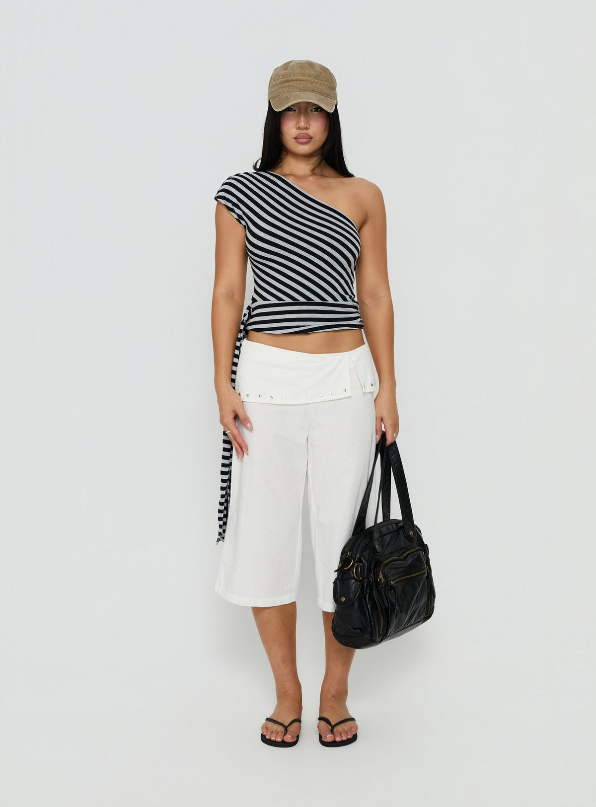 Showcasing the Oren Capri Trouser Ivory womens-regular-pants with mid-rise and belt front view of model wearing Princess Polly