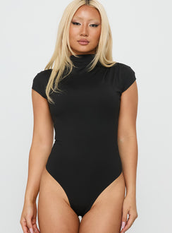Designed with the Cailie Mock Neck Bodysuit Black womens-bodysuit featuring short sleeves front view of model wearing Princess Polly