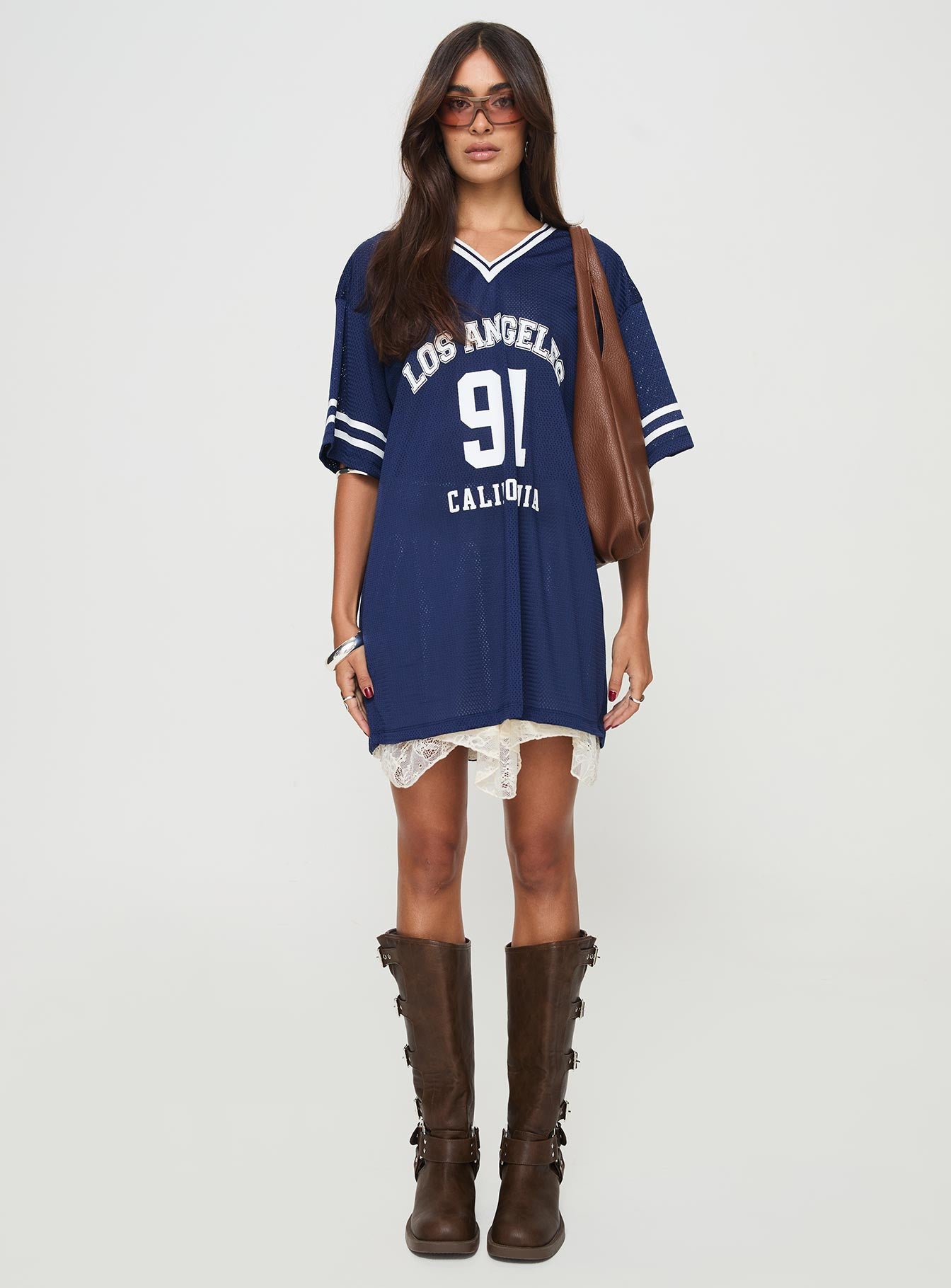 side view of model wearing Princess Polly Michail Jersey Dress Navy V-Neck 