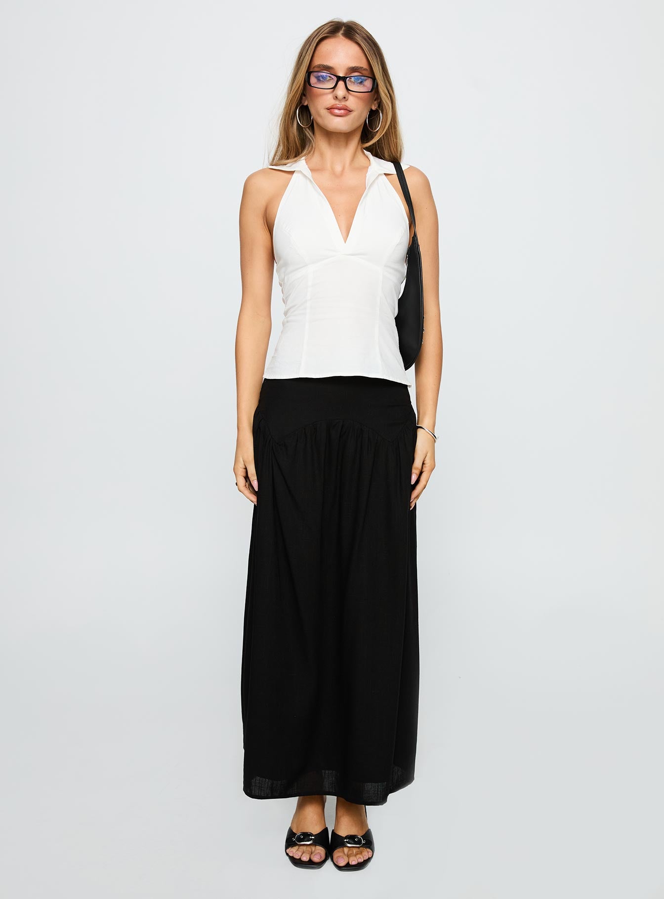 back view of model wearing Princess Polly Human Nurture Maxi Skirt Black Maxi 