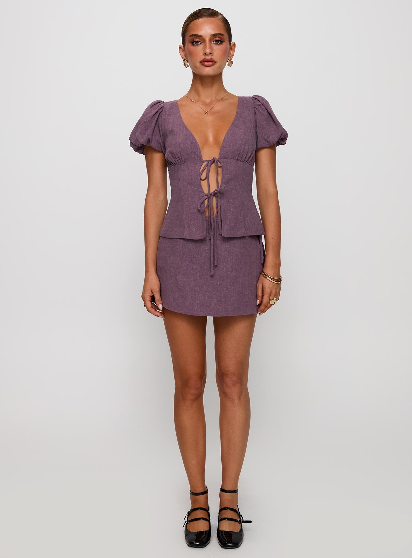 front view of model wearing Princess Polly Gulliver Tie Side Mini Skort Mauve High Waisted Shorts 