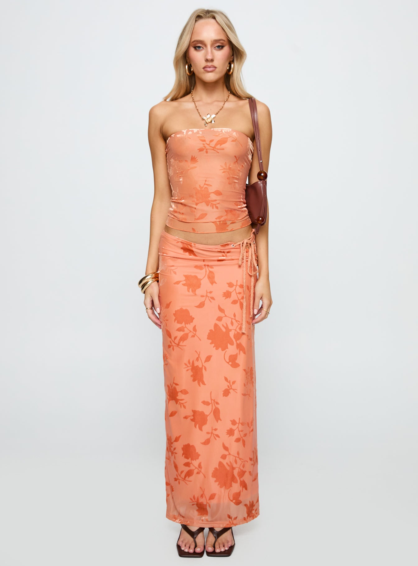 side view of model wearing Princess Polly Mikah Strapless Top Orange Sleeveless straight 