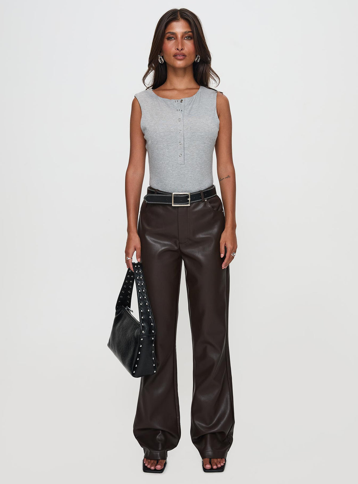 side view of model wearing Princess Polly Nolene Low Rise Pants Chocolate High Waisted Pants 