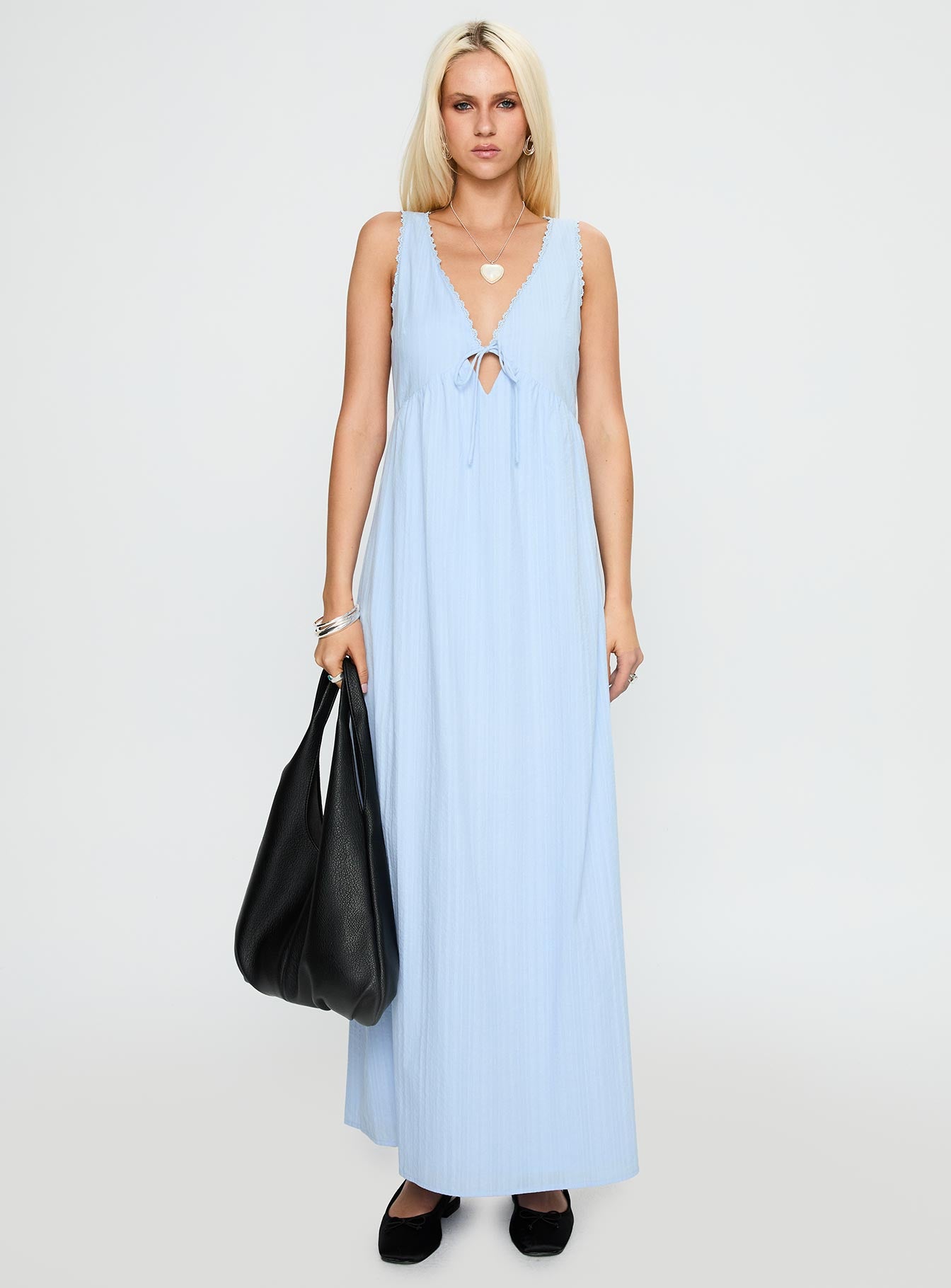 side view of model wearing Princess Polly Elyza Maxi Dress Blue Plunger 