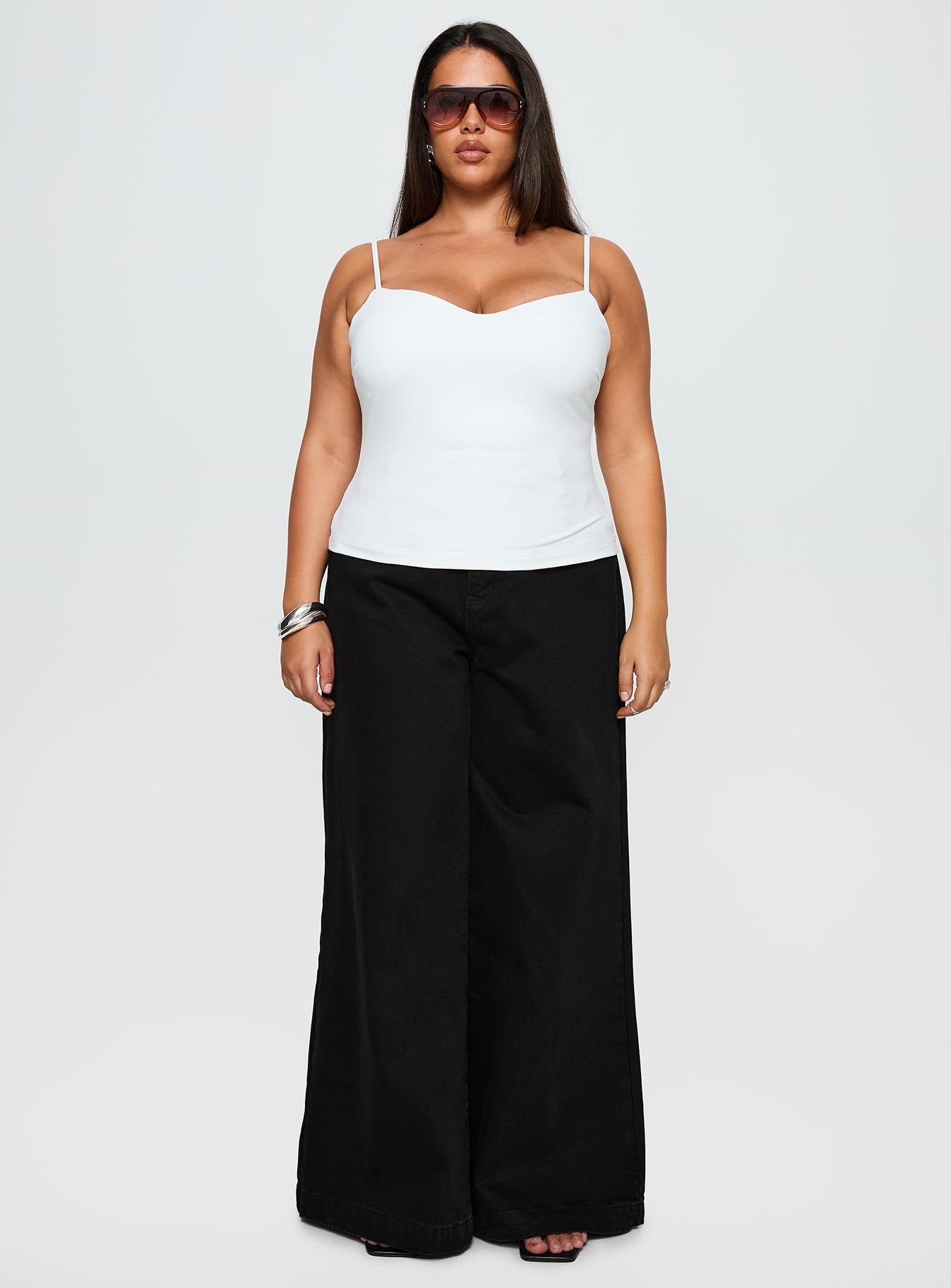 side view of model wearing Princess Polly Goldie High Wide Jean True Black Curve High Waisted 