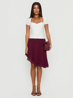   front view of model wearing Princess Polly Evanescence Asymmetrical Midi Skirt Cherry 
