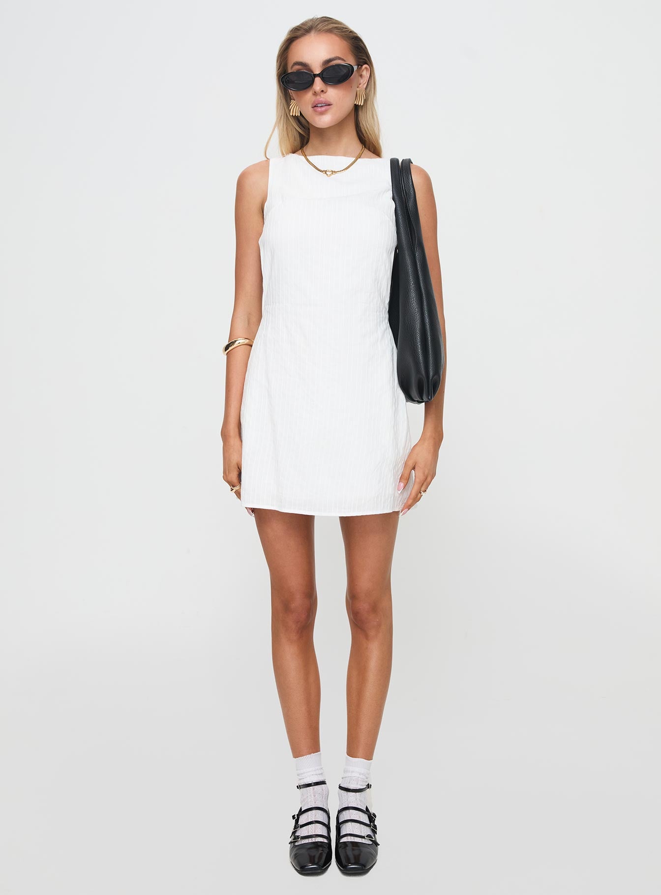 side view of model wearing Princess Polly Swoon Mini Dress White Boat Neck 