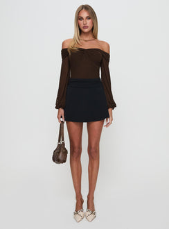 Featuring the Babette Off The Shoulder Bodysuit in Brown womens-bodysuit designed with full sleeves and ruched details front view of model wearing