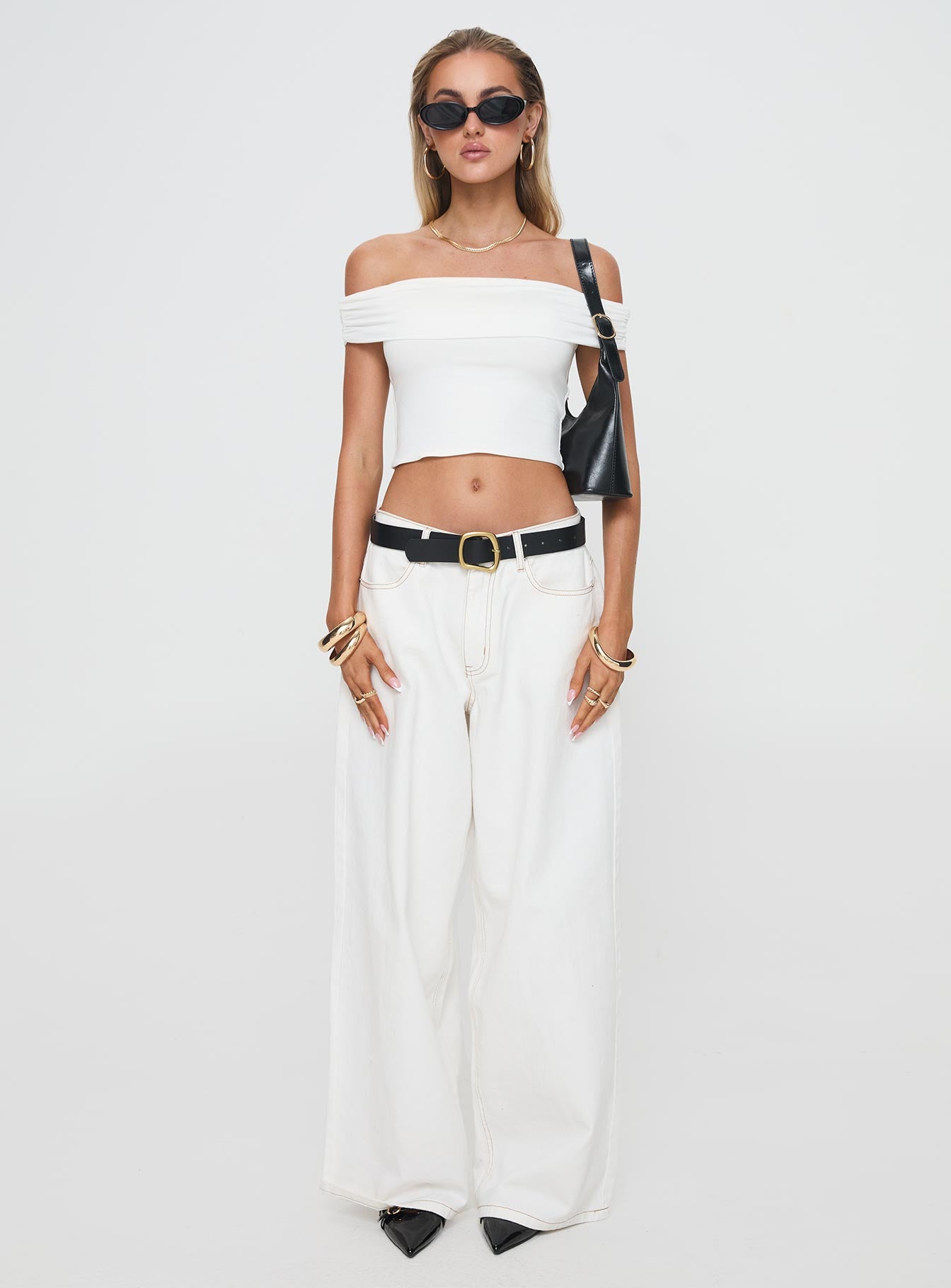 side view of model wearing Princess Polly Channel Off The Shoulder Top White Short Sleeves straight 