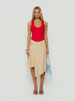Discover the Ellainah Asymmetrical Wrap Midi Skirt Concrete in tan front view of model wearing Princess Polly