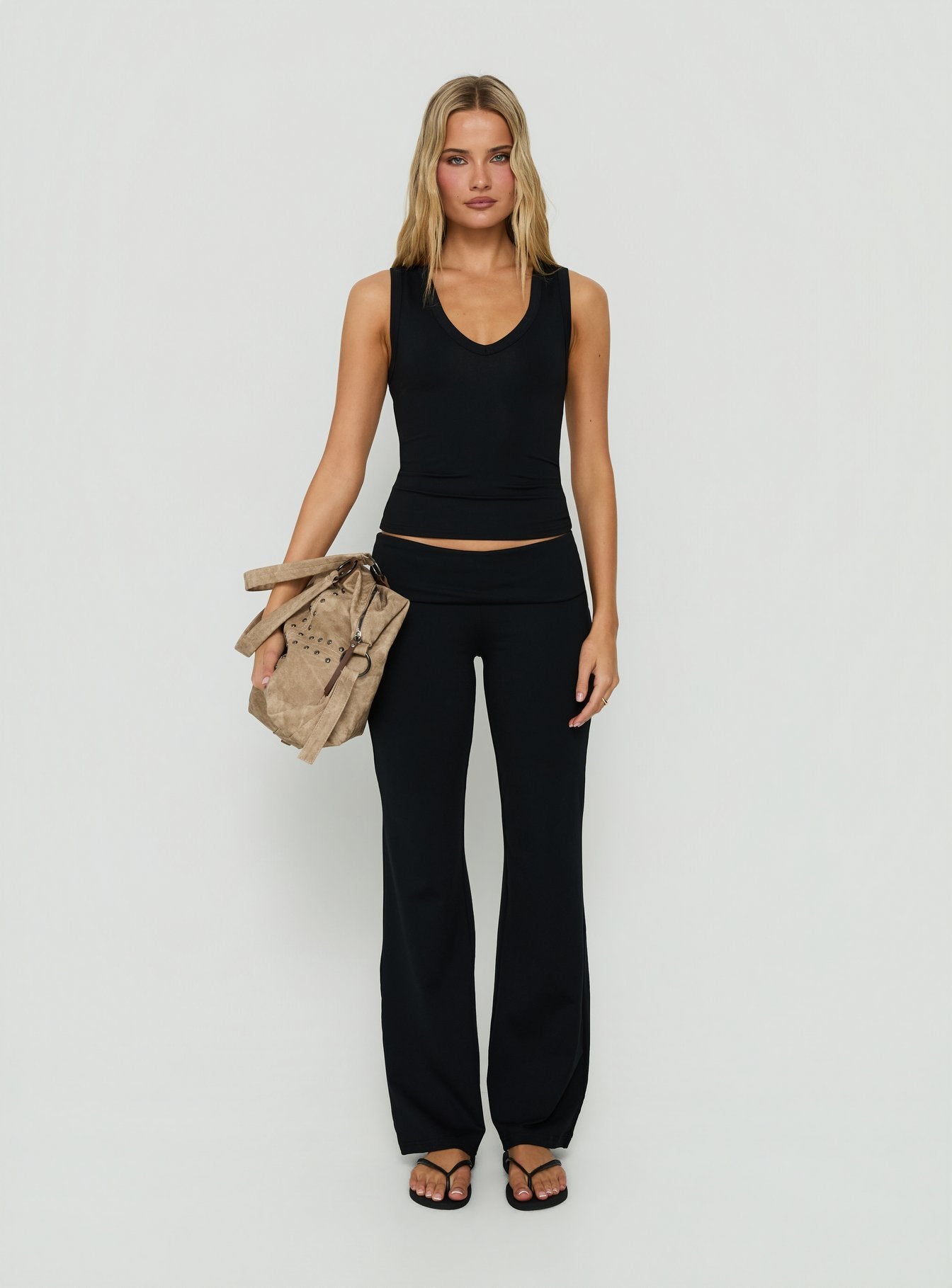 Showcasing Daily Define Foldover Waist Pants Black womens-regular-pants with high-rise front view of model wearing