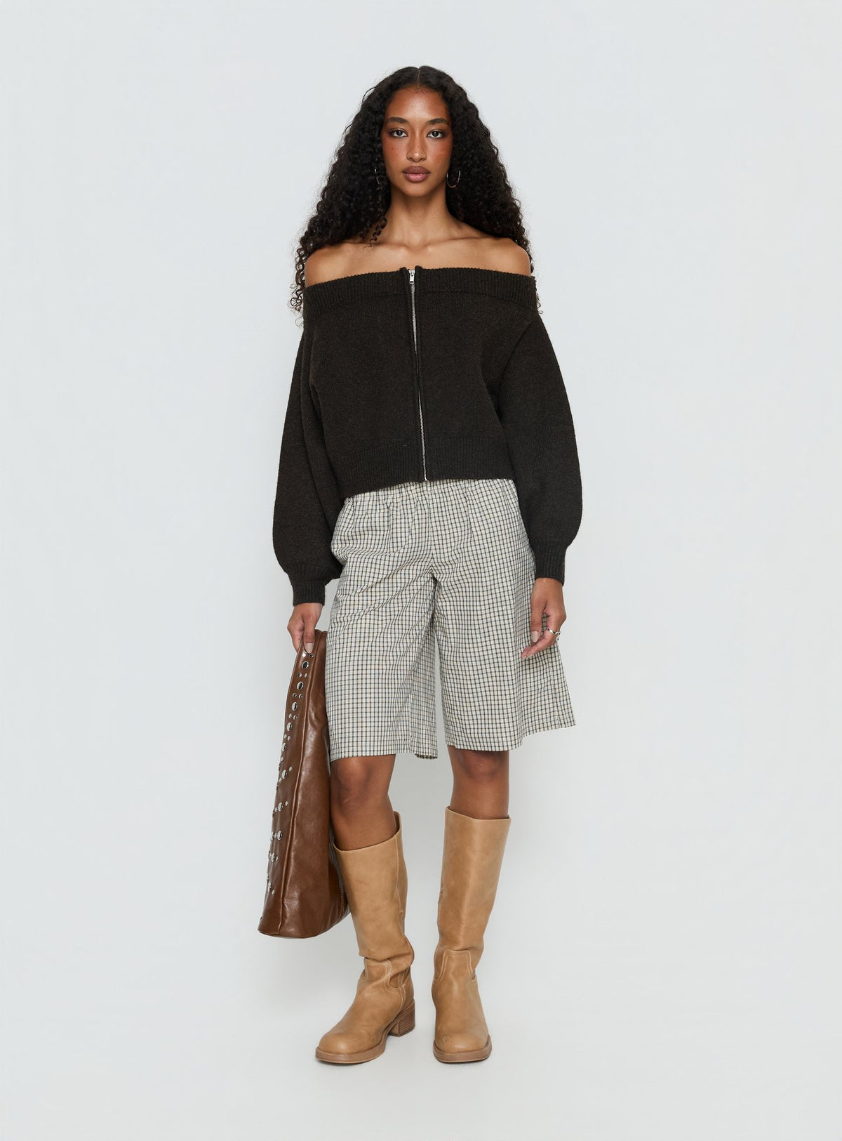side view of model wearing Princess Polly Ortensa Off Shoulder Zip Through Jumper Brown 