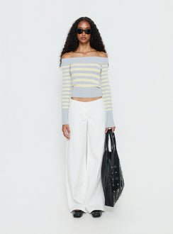 side view of model wearing Princess Polly Hereos Mid Rise Baggy Leg Jeans White Mid Rise Jeans 