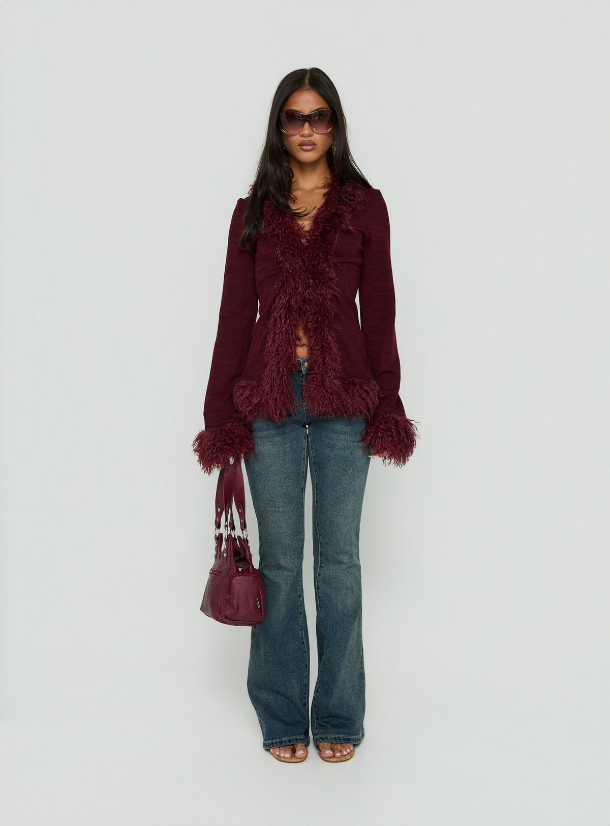 Introducing the Brynlie Faux Fur Trim Boxy Cardigan Burgundy womens jumper with short length front view of model wearing Princess Polly