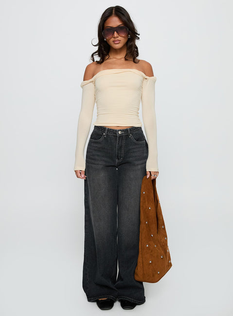 side view of model wearing Princess Polly Dusky Long Sleeve Top Cream Full Sleeves straight 