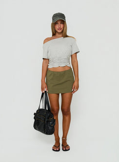 Introducing the Lunea Concealed Waistband Mini Skirt in Olive Green, a fitted womens-skirts design front view of model wearing Princess Polly