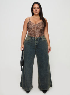 front view of model wearing Princess Polly Ziggie Low Rise Ultra Baggy Jeans Antique Wash Curve High Waisted 