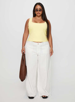 side view of model wearing Princess Polly Baseline Square Neck Rib Tank Top Lemon Curve Sleeveless Square Neck 