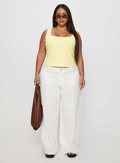 side view of model wearing Princess Polly Baseline Square Neck Rib Tank Top Lemon Curve Sleeveless Square Neck 