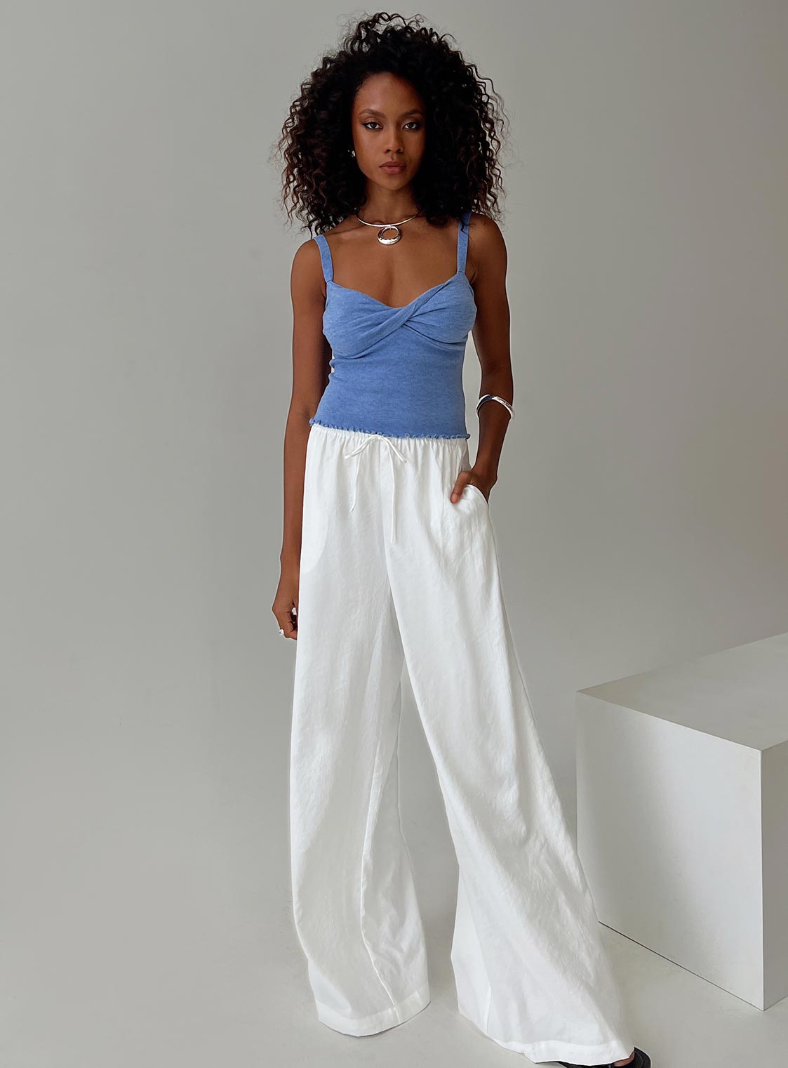 front view of model wearing Princess Polly Dalma Twist Top Blue Sleeveless Plunger 