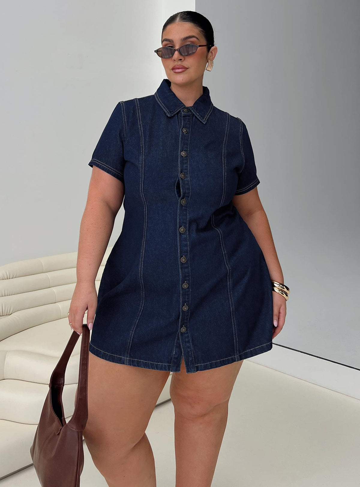 side view of model wearing Princess Polly Perception Denim Mini Dress Mid Wash Curve V-Neck 