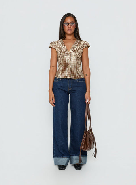 front view of model wearing Princess Polly Darla Low Rise Straight Leg Cuff Jean Dark Blue Wash Low Rise Jeans 