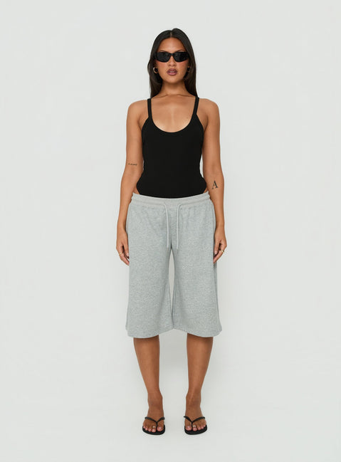 Introducing the Nerinah Ribbed Bodysuit in Black womens-bodysuit with sleeveless styling front view of model wearing