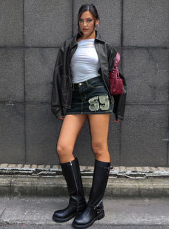   side view of model wearing Princess Polly Standout Patch Detail Denim Skort Blue Mini Skirts 