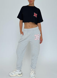 front view of model wearing Princess Polly Harvard Graphic Track Top Black Short Sleeves Crew Neck 
