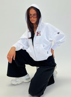 side view of model wearing Princess Polly Harvard Raglan Zip Up White / Red Jumpers 