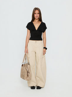 front view of model wearing Princess Polly Selective Memory Low Rise Wide Leg Cargo Pants Cream Low Rise Pants 