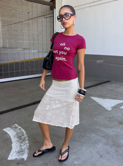 Showcasing the Heart Stealer Sheer Sequin Midi Skirt in White with fitted a-line shape and frayed hem front view of model wearing Princess Polly