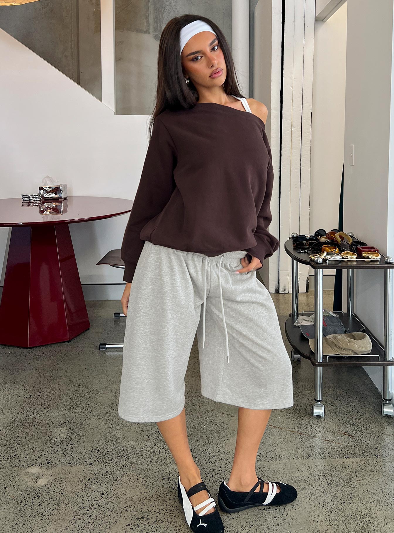 Showcasing the Nikko Longline Fleece Shorts Grey Marle in womens regular pants with mid-rise front view of model wearing Princess Polly