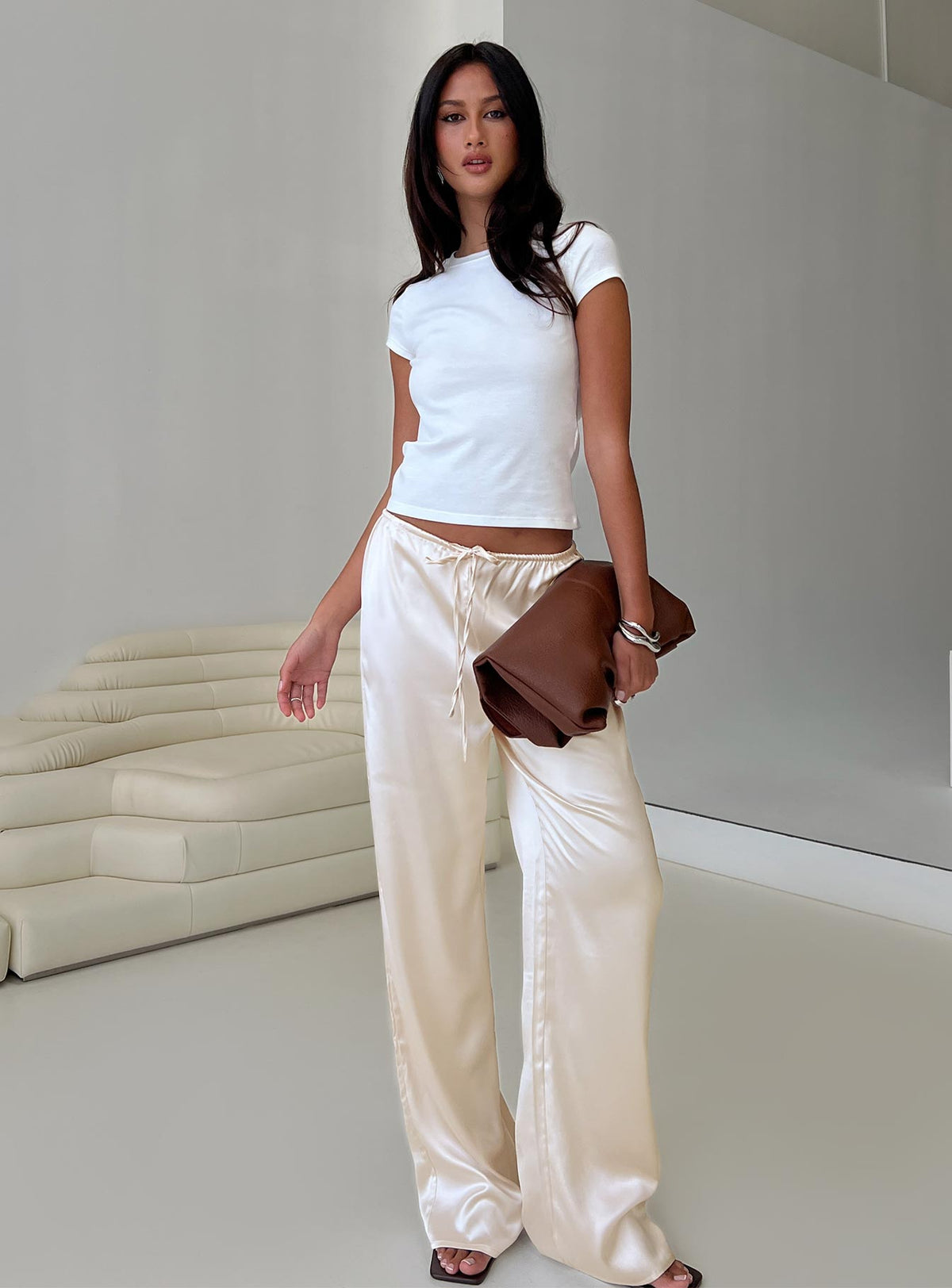 back view of model wearing Princess Polly Soulstar Satin Pants Champagne Low Rise Pants 
