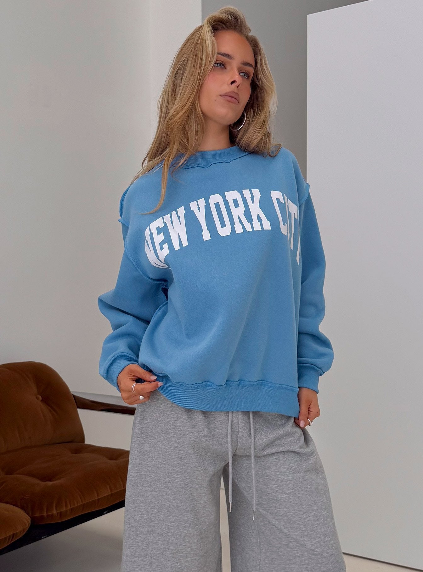 Featuring the When In New York City Oversized Jumper Blue womens jumper with long fit on-body Princess Polly