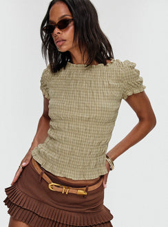 side view of model wearing Princess Polly Deei Double Ruffle Mini Skort Chocolate Low Rise Shorts 